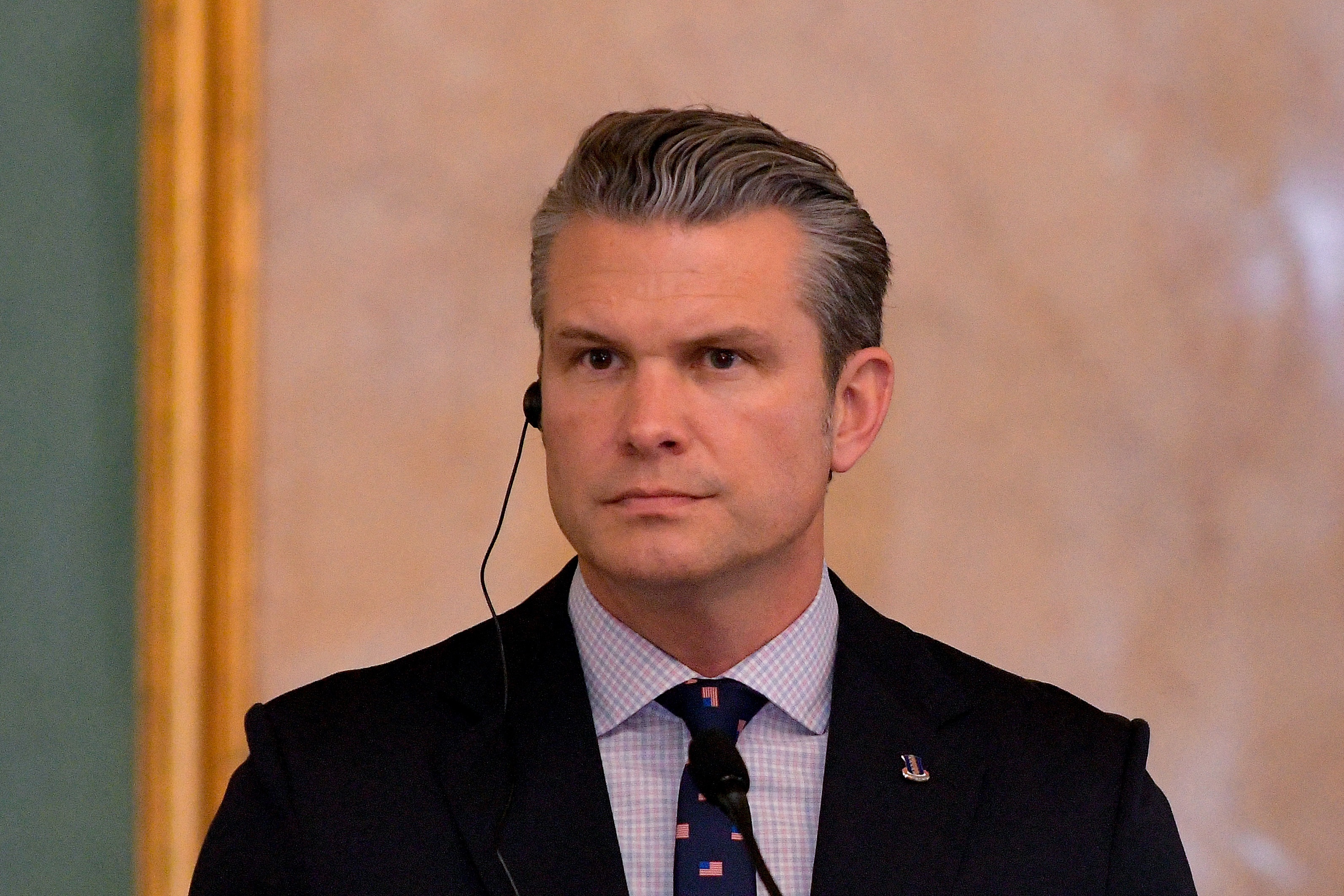 Defense Secretary Pete Hegseth, pictured at a late Novermber press conference, is facing scrutiny for U.S. attacks on alleged drug boats — and a parody of a children